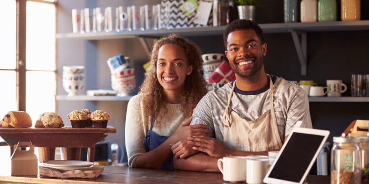 A small business with rooftop solar panels showing how businesses can save money with solar energy.